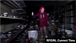 Tolgonai Arapova, owner of the largest retail store in the Kyrgyz village of Arka, shows what is left of her facility after an attack during April 28-April 29, 2021 fighting with Tajikistan..