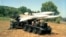 MIM-23 Hawk loading vehicle reloading a launching trailer