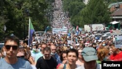 Tens of thousands of protesters march in Khabarovsk on July 18.