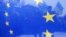 UKRAINE – Pro-European integration protesters are seen through an EU flag during a rally near the Interior Ministry headquarters in Kyiv December 17, 2013