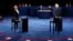 U.S. -- Democratic nominee Hillary Clinton (L) and Republican nominee Donald Trump arrive on stage during the second presidential debate at Washington University in St. Louis, Missouri, October 9, 2016
