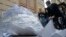 An activist of Vesna (Spring) youth movement fills a bag with two thousand paper planes