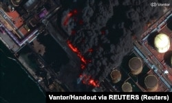 Пожар в порту Усть-Луга на Балтике в Ленинградской области России после украинского удара дронами 27 марта 2026 года (спутниковый снимок в инфракрасном диапазоне)