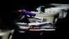U.S. -- Election personnel handle ballots as vote counting in the general election continues at State Farm Arena, Wednesday, Nov. 4, 2020, in Atlanta.