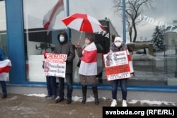 A trio of protesters in Minsk on February 11, 2021