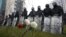 BELARUS-ELECTION/PROTESTS?Law enforcement officers stand guard during a rally to reject the presidential election results in Minsk