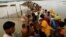 BANGLADESH -- Rohingya refugees wait for boat to cross a canal after crossing the border through the Naf river in Teknaf, Bangladesh, September 7, 2017