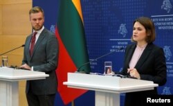 Belarusian opposition leader Svyatlana Tsikhanouskaya holds a joint press conference with Lithuanian Foreign Minister Gabrielius Landsbergis in Vilnius, Lithuania to mark the first anniversary of Belarus' August 9, 2020 presidential elections.