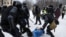RUSSIA – Russian police officers detain protester during an unauthorized protest in support of Russian opposition leader Alexei Navalny, in St. Petersburg, Russia, 31 January 2021