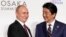 Osaka, Japan - Russia's President Vladimir Putin and Japan's Prime Minister Shinzo Abe / Russia's President Vladimir Putin is greeted by Japan's Prime Minister Shinzo Abe at the G20 leaders summit in Osaka, Japan, June 28, 2019.  REUTERS/Kevin Lamarque