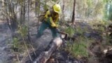 Якутия. Во время ликвидации лесного пожара. По данным Минэкологии Якутии, в лесах тушат 93 пожара общей площадью 236,9 тысяч гектаров. 