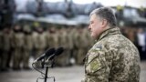 UKRAINE – Ukraine's President Petro Poroshenko delivers a speech during a ceremony to hand over weapons and military vehicles to servicemen of the Ukrainian armed forces at an airforce base near Zhytomyr, December 21, 2018