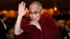 U.S. -- The Dalai Lama waves towards the head table, where US President Barack Obama was seated, during the National Prayer Breakfast in Washington, February 5, 2015