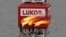 FILE PHOTO: A gas torch is seen next to the Lukoil company sign at the Filanovskogo oil platform in the Caspian Sea
