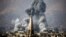SYRIA -- Smoke rises following a reported air strike on the rebel-held besieged town of Arbin, in the Eastern Ghouta region on the outskirts of Damascus, November 23, 2017