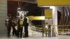 Police officers stand at Victoria Station in Manchester