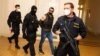 Aleksandr Franchetti (in handcuffs) appears for his hearing at the Prague Municipal Court on September 14.