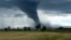 Shutterstock -- tornado forming over farmland, dramatic storm clouds, disaster, natire, generic, undated
