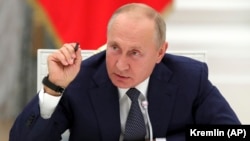 RUSSIA -- Russian President Vladimir Putin gestures speaks at the Kremlin in Moscow, September 23, 2020