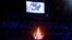 Tokyo 2020 Olympics - The Tokyo 2020 Olympics Closing Ceremony - Olympic Stadium, Tokyo, Japan - August 8, 2021. The Olympic torch and cauldron are seen with Paris 2024 displayed on the big screen during the closing ceremony REUTERS/Toby Melville