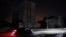 Russia -- A car drives along a dark street during a power blackout