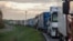 Trucks queue on a motorway as Polish transport company owners with their vehicles block access to the Polish-Ukrainian border crossing in Dorohusk, Poland on November 6, 2023 to protest against 'unfair' competition.