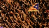 SPAIN -- People raise arms and shout during a demonstration two days after the banned independence referendum in Barcelona, Spain, October 3, 2017