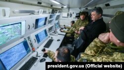 Former Ukrainian President Petro Poroshenko observes Ukrainian military testing of a Bayraktar UAV in 2019.