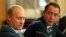 Russia -- Russian President Vladimir Putin (L) gestures as Mass Media Minister Mikhail Lesin listens to him during a meeting with local press in the far eastern city of Vladivostok, August 24, 2002