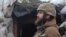 UKRAINE -- A service member of the Ukrainian armed forces stands guard at fighting positions on the line of separation near the rebel-controlled city of Donetsk, April 6, 2021