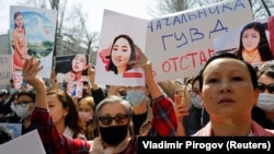 Kyrgyz attend an April 8, 2021 rally in Bishkek to demand the resignation of the interior minister for the alleged inaction of police in response to the kidnapping of Aizada Kanatbekova, who was found murdered. 