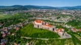 UKRAINE – Beautiful panoramic aerial view to Palanok Castle in the city of Mukachevo, Zakarpattia Oblast