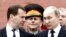 Russia -- President Vladimir Putin (R) and Prime Minister Dmitry Medvedev attend a ceremony to commemorate the anniversary of the beginning of the Great Patriotic War against Nazi Germany in 1941 at the Tomb of the Unknown Soldier by the Kremlin walls in 