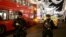 Armed police officers stand on Oxford Street, London, Britain November 24, 2017