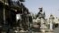 Afganistan -- A US soldier keeps watch at the site of a blast in Laghman province, 20Nov2010