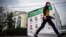 RUSSIA -- A man walks past an election banner for the Yabloko liberal party in the Siberian city of Tomsk, September 7, 2020