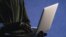 Georgia -- Hacker with laptop 