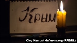 Ukraine, Crimea - A burning candle, 04Dec2014