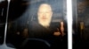 U.K. -- WikiLeaks founder Julian Assange is seen in a police van, after he was arrested by British police, in London, Britain April 11, 2019. 