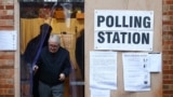 London, Britain - An elder leaves the garage of a residential house, converted to a poling station, to vote in the general election in South Croydon, in London, Britain, December 12, 2019