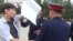 В Казахстане полицейские задержали парня, который стоял с белым листом бумаги