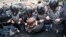 RUSSIA -- Russian police officers push a teenager during a rally protesting retirement age hikes in St. Petersburg, September 9, 2018