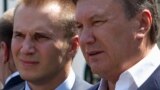 Ukraine -- Ukrainian President Viktor Yanukovych (R) is pictured with his son Oleksandr on a street in Donetsk, April 2010