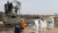 Japan -- Residents who lived within a 20km area of a stricken nuclear power plant offer prayers for victims of the March 11 earthquake and tsunami, in Namie, Fukushima prefecture on May 26, 2011