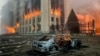 ALMATY, KAZAKHSTAN - JANUARY 5, 2022: A burnt car is seen by the mayor’s office on fire. Protests are spreading across Kazakhstan over the rising fuel prices; protesters broke into the Almaty mayor’s office and set it on fire. Valery Sharifulin/TASS 