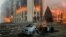 ALMATY, KAZAKHSTAN - JANUARY 5, 2022: A burnt car is seen by the mayor’s office on fire. Protests are spreading across Kazakhstan over the rising fuel prices; protesters broke into the Almaty mayor’s office and set it on fire. Valery Sharifulin/TASS 