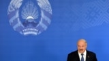 Belarus -- Belarusian President Alyaksandr Lukashenka speaks with journalists during presidential elections at a polling station in Minsk, October 11, 2015