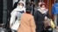 Iranian women wearing face mask walk past in a street of Tehran, Iran, 26 February 2020.