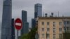 Russia -- A krushchyovka apartment block lurks in the shadow of Moscow's skyscrapers, May 17, 2017