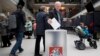 Lithuania -- A local resident cast their ballots at a polling station during the advance presidential elections in Vilnius, Lithuania, Tuesday, May 7, 2019